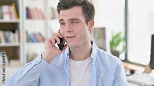 Young Man Talking on Smartphone