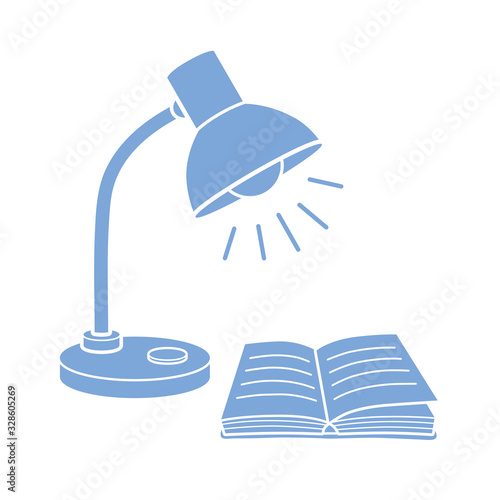 Desk lamp and an open book flat icon