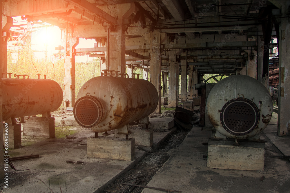 Old abandoned factory with rusty remains of equipment Old abandoned factory with rusty remains of equipment