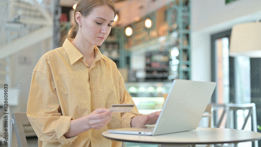 Young Woman Shopping Online on Laptop Young Woman Shopping Online on Laptop