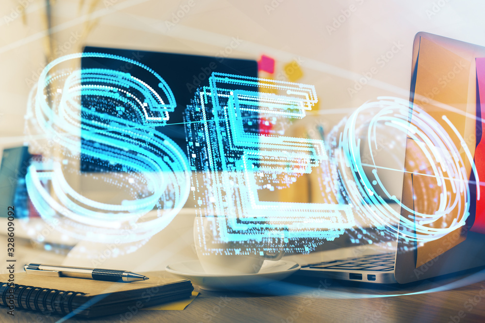 Double exposure of table with computer and seo drawing hologram. Search optimization concept. Double exposure of table with computer and seo drawing hologram. Search optimization concept.