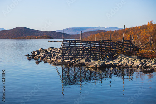 View of Kilpisjarvi village, with Saana mountain, Lake Kilpisjärvi, Enontekiö municipality, Lapland, Finland, the very northwesternmost point of Finland, autumn fall view photo