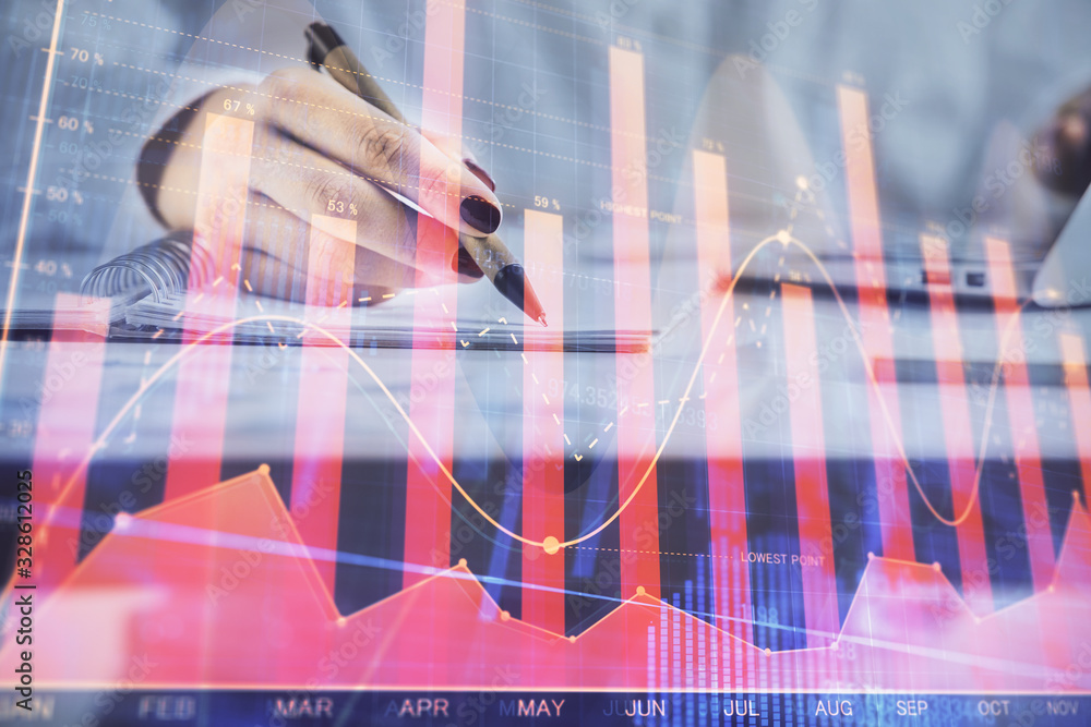 Double exposure of woman's hands making notes with forex graph hologram. Concept technical analysis. Double exposure of woman's hands making notes with forex graph hologram. Concept technical analysis.