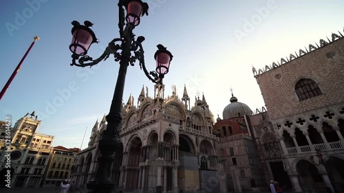 Slow motion. Saint Mark's square, St. Mark’s Basilica. Famous landmark in Venice, Italy. Romantic honeymoon travel & cruise ship destination in Europe.  photo