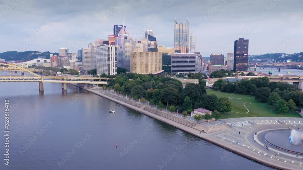 Aerial: Ferry boat on the Allegheny River river at sunset and downtown Pittsburgh, Pennsylvania, USA Aerial: Ferry boat on the Allegheny River river at sunset and downtown Pittsburgh, Pennsylvania, USA