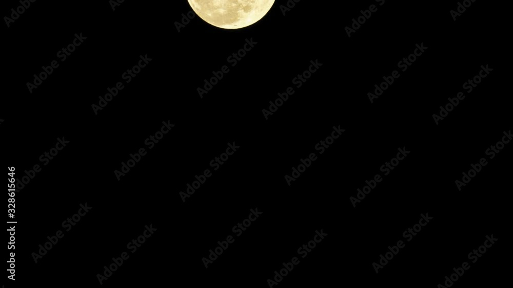 Big yellow moon crossing night sky. Timelapse. Big yellow moon crossing night sky. Timelapse.