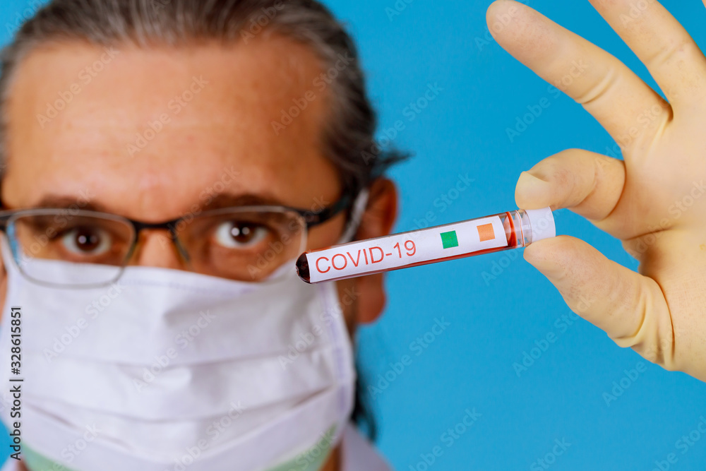 Covid 19 coronavirus infected blood sample in sample tube in hand of doctor Covid 19 coronavirus infected blood sample in sample tube in hand of doctor