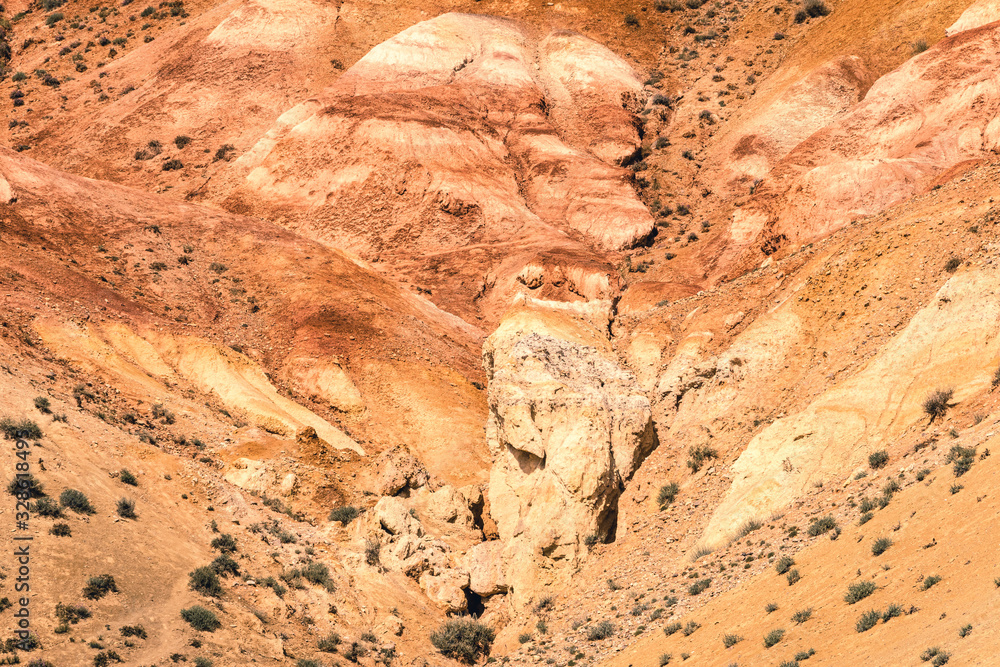 Red canyon in hills. Soil erosion following drought, climate change and formation of gullies. Lack of water in dry steppe