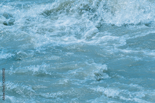 rushing water of fast flowing river, storm waves of ocean, sea surf