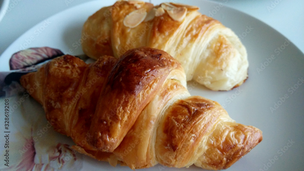 Close-up croissants on a white plate