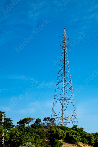 A high electric pole and transmission line on an island