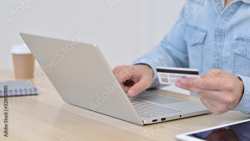 Close up of Online Payment on Laptop by Man
