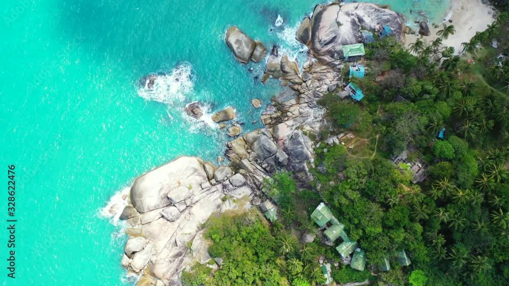 Ao than sadet bay rocky shore, turquoise sea water and exotic trees. Aerial vertical background Ao than sadet bay rocky shore, turquoise sea water and exotic trees. Aerial vertical background