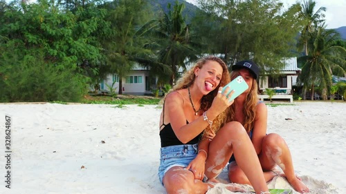 lovely girls influencers vlogging on summer vacation. Beautiful Thailand coast, funny women and modern technology photo