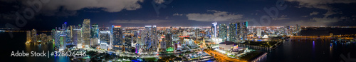 Amazing aerial panorama of Downtown Miami FL USA at night with bright city lights