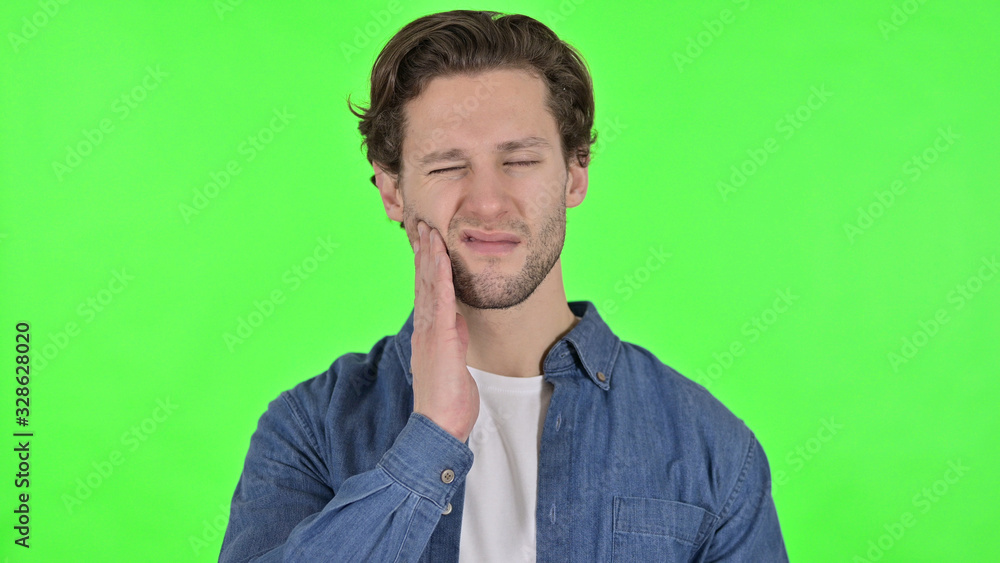 Portrait of Young Man with Toothache on Green Chroma Key Portrait of Young Man with Toothache on Green Chroma Key