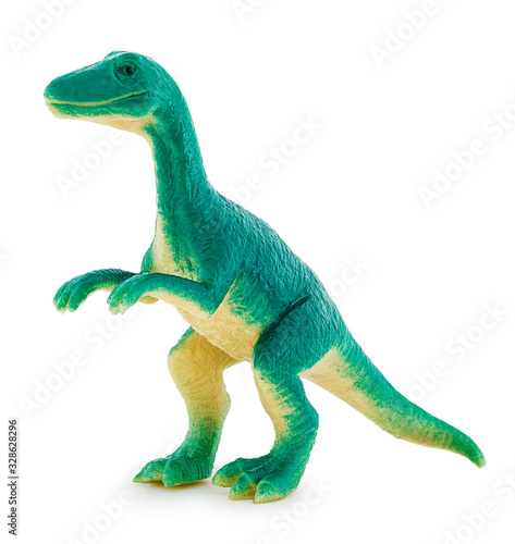 Herrerasaurus plastic toy. Isolated on white background with natural shadow. Herrera s lizard dinosaur on white bg.