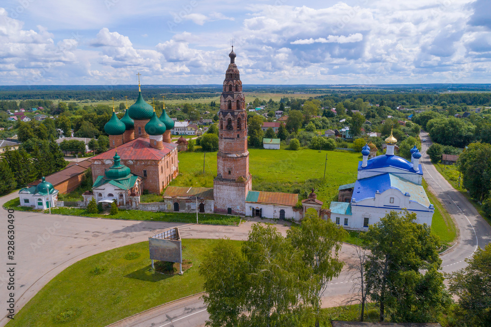View of the ancient temples of Velikoye village on a sunny July day (shooting from a quadrocopter). Yaroslavl region, Russia