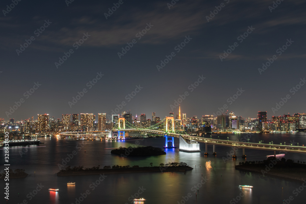view of the river in Odaiba Tokyo. Rainbow Bridge at Night.