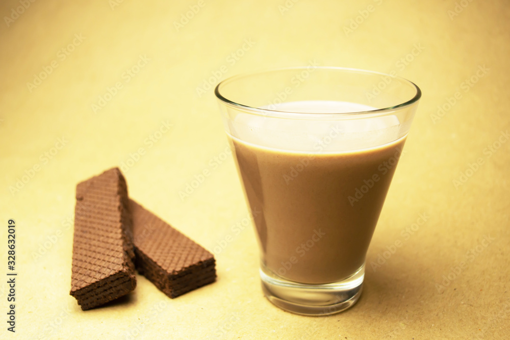 Cocoa milk and two chocolate waffles Cocoa milk and two chocolate waffles