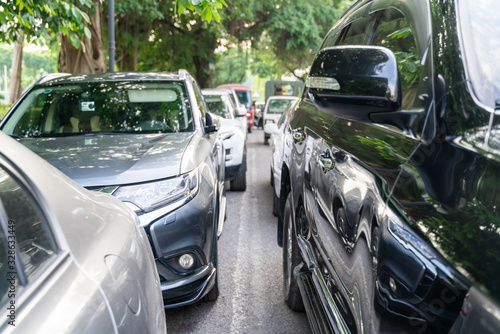 Long line of cars on urban street with front view © Hanoi Photography