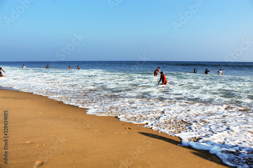 Golden Sea beach visitors in the sea white foam wave blue sky beautiful sea scape dated 21 february 2020 Puri Odisha India