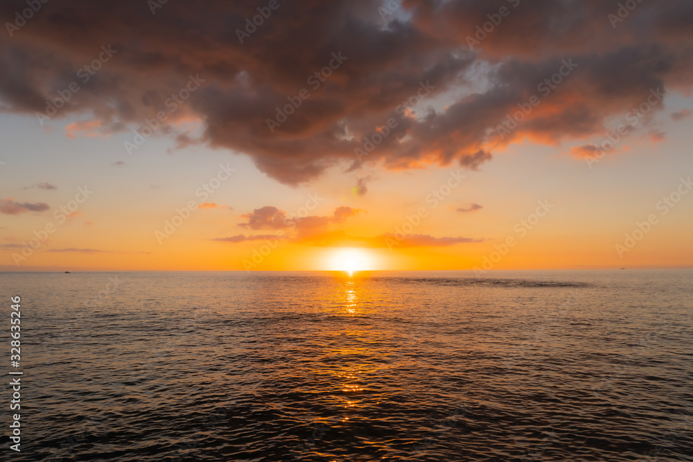 Sun Set over Hawaiian Ocean with Colorful Clouds