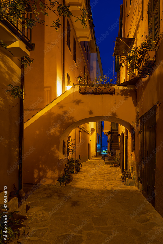 Night scene in the old town of Imperia, Italy