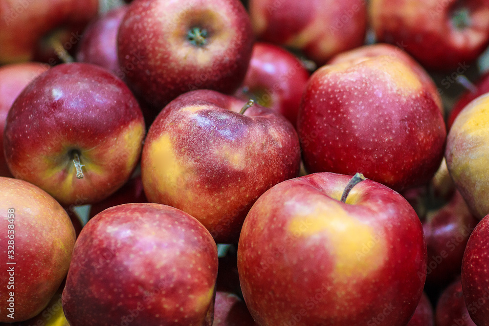 Lots of fresh delicious red apples as background Lots of fresh delicious red apples as background