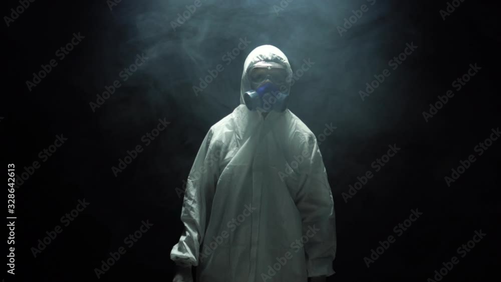 Doctor in a protective suit,Medical scientist working in lab with probes glasses test tubes. Doctor in a protective suit,Medical scientist working in lab with probes glasses test tubes.