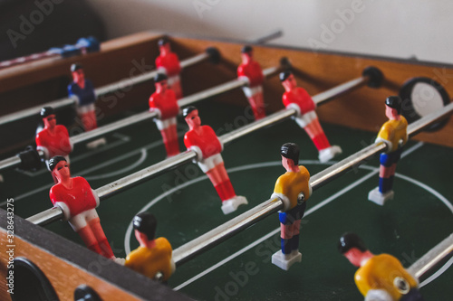 Table with players for playing table football