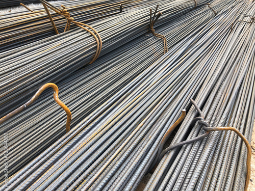 Steel reinforcement rebars tied with metal wire at the outdoor warehouse photo