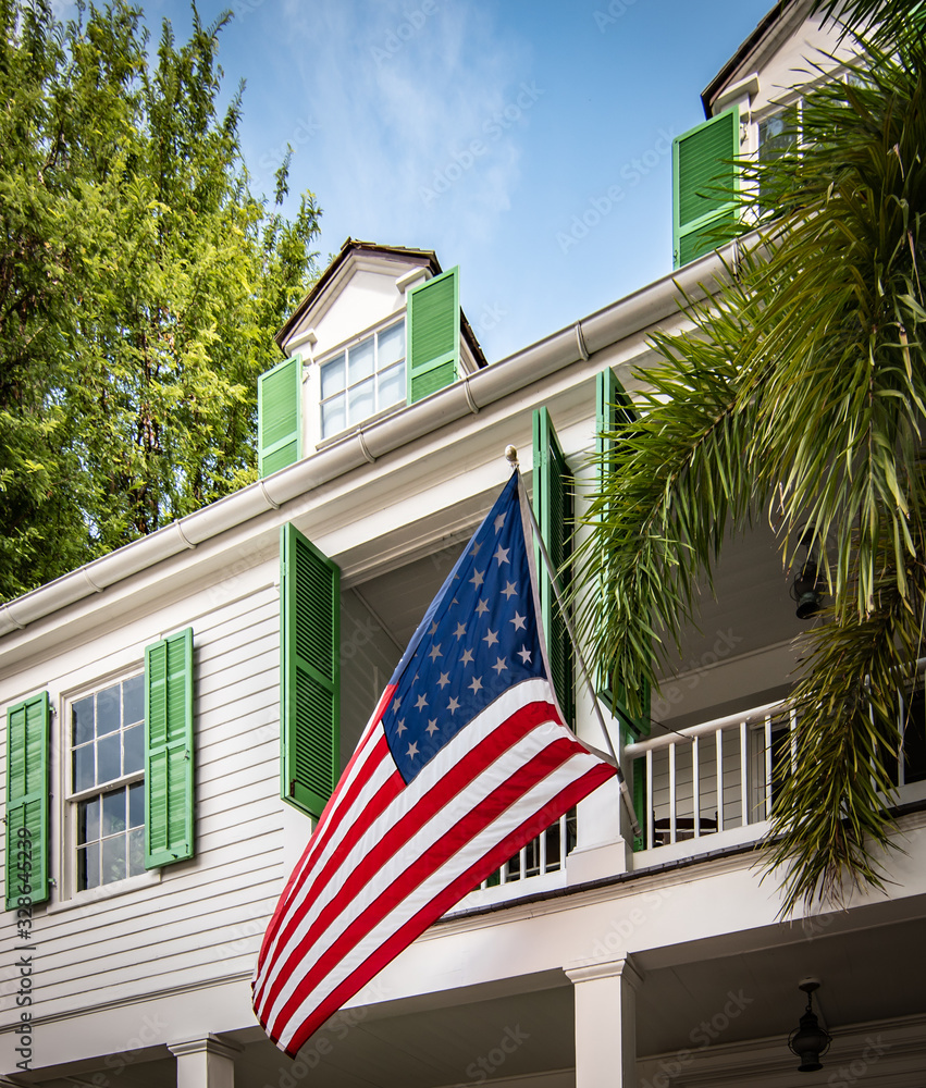 American flag in front of a house in Key West, Florida, USA