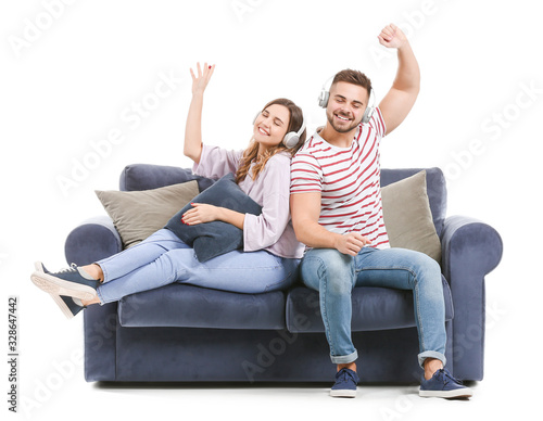 Young couple listening to m...