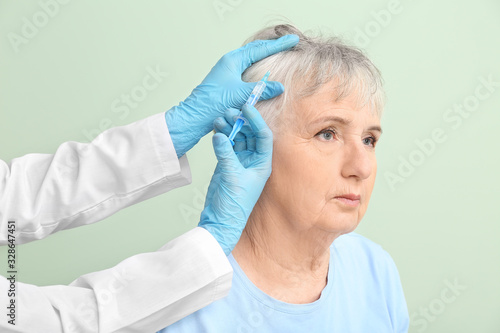 Senior woman with hair loss...