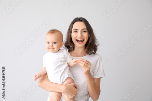 Cute baby with mother on li...