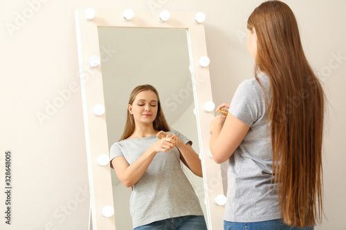 Beautiful young woman apply...