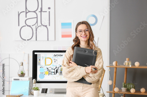 Portrait of female interior designer in office photo