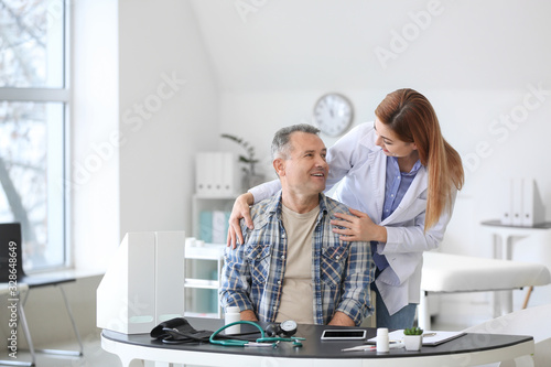 Mature man visiting doctor ...
