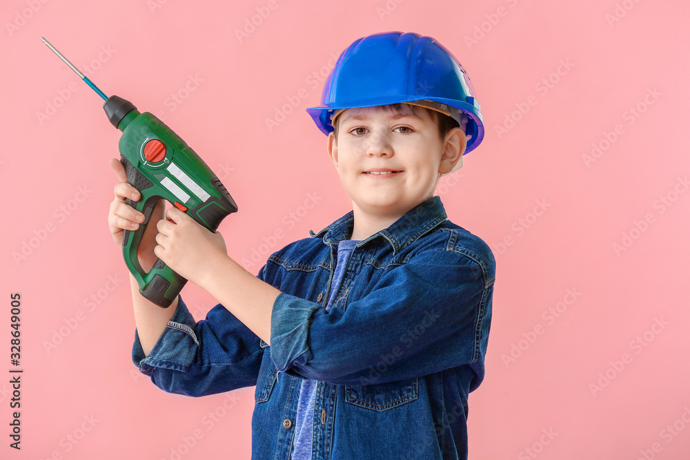 Cute little builder on color background Cute little builder on color background