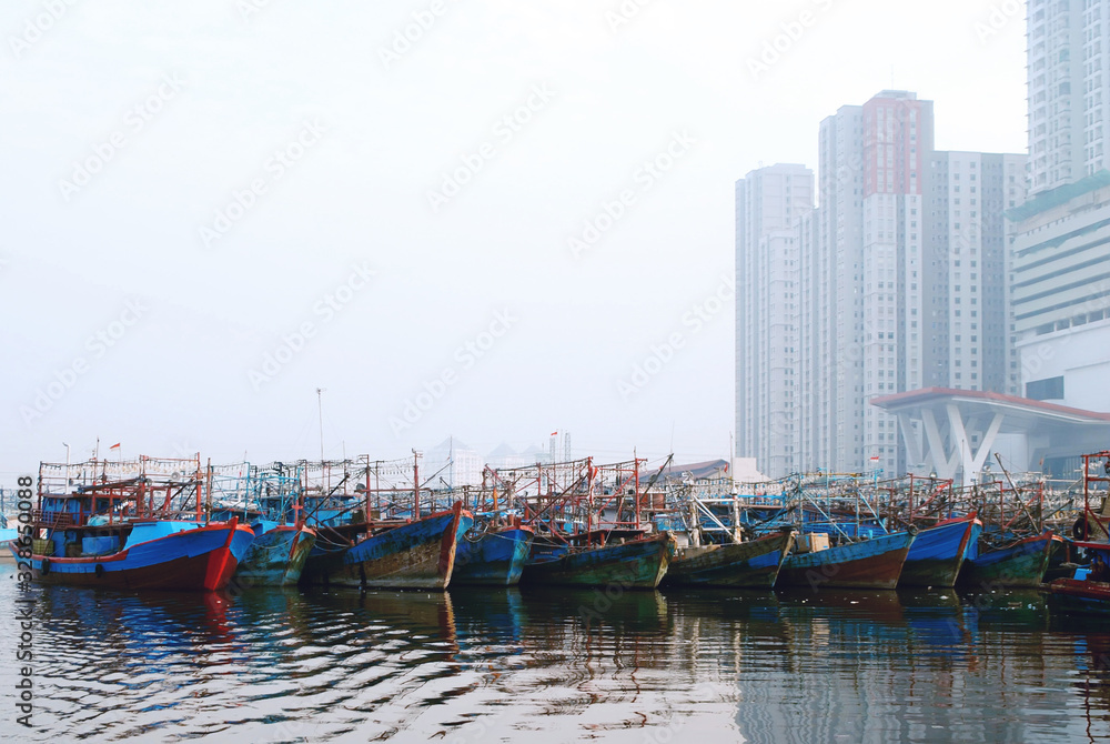 many boats in the harbour in jakarta harbour