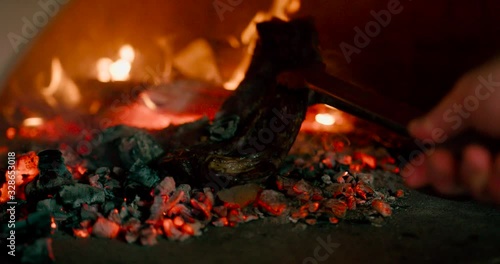 Prepare a steak from raw meat on a barbecue  photo