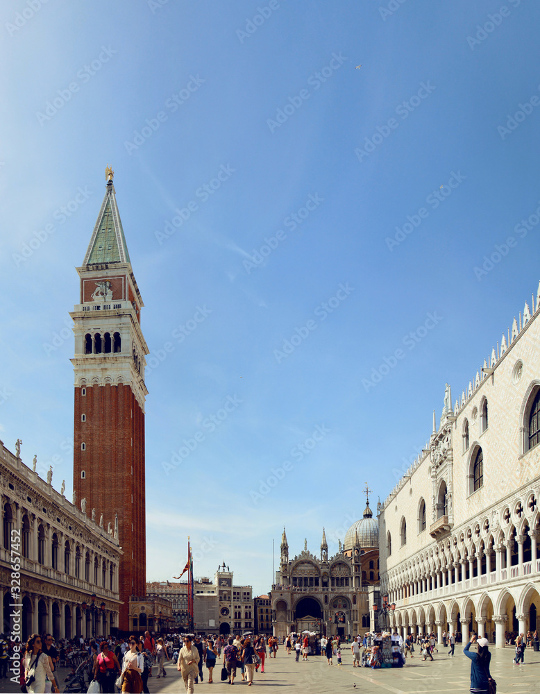 The architectural ensemble of St. Mark's Square with the Campanile (Campanile di San Marco) and the Cathedral (St Mark's Basilica). Venice. Italy.