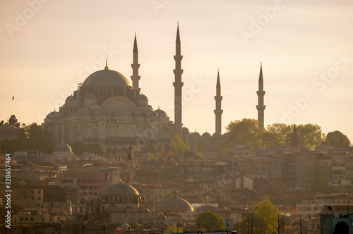 Scenic sunset silhouette view of the domes and minarets of Süleymaniye Mosque on the Third Hill in the Golden Horn, Istanbul, Turkey