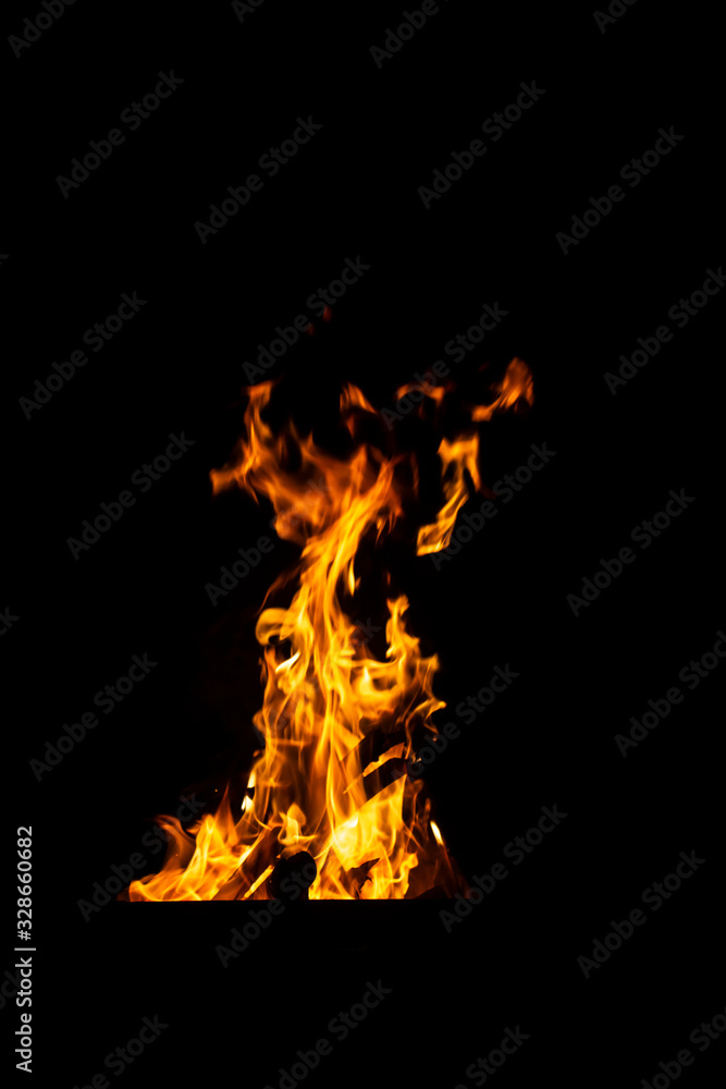 Danger fire on a dark background. Background from fire. Fire pattern can be used in design Danger fire on a dark background. Background from fire. Fire pattern can be used in design