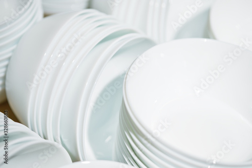 Modern folded white plates in piles.
