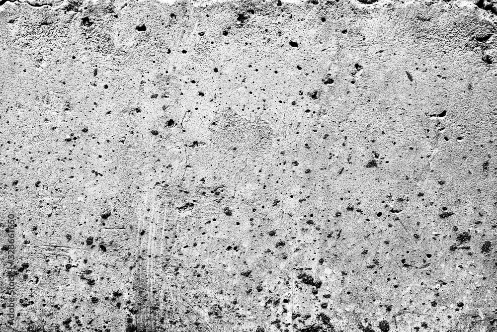 Fototapeta premium Texture of a concrete wall with cracks and scratches which can be used as a background