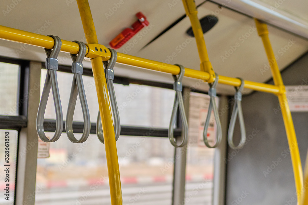 Rubber hinges on metal pipes for safety in public transport.