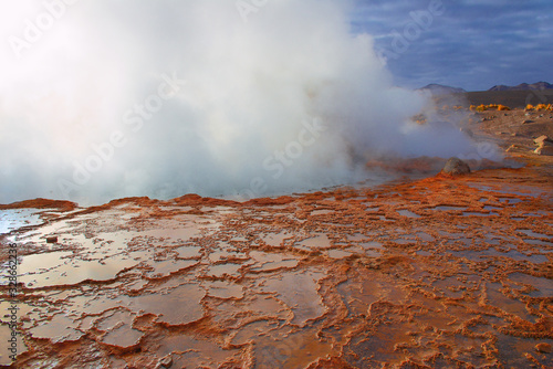 Steam of one of the beautiful El Tatio geysers at sunrise, Chile. Located at 4,320 meters above the sea level El Tatio geyser valley is one the highest elevated geyser field in the world