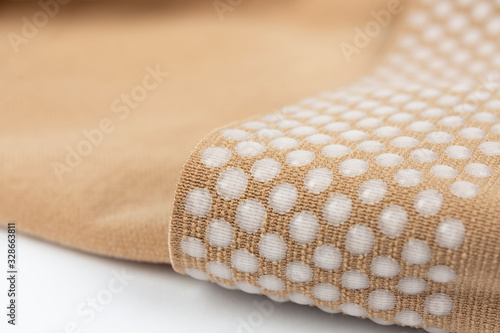 Close up of Compression stockings for leg lymphedema (edema) to improve blood circulation, reduce pain and swelling in the feet or legs, and reduce the chances of circulatory issues photo